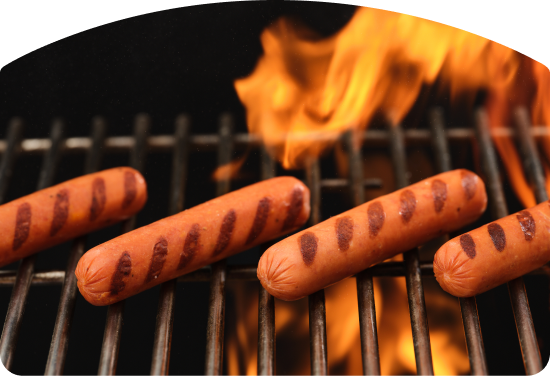 hot dogs on a grill